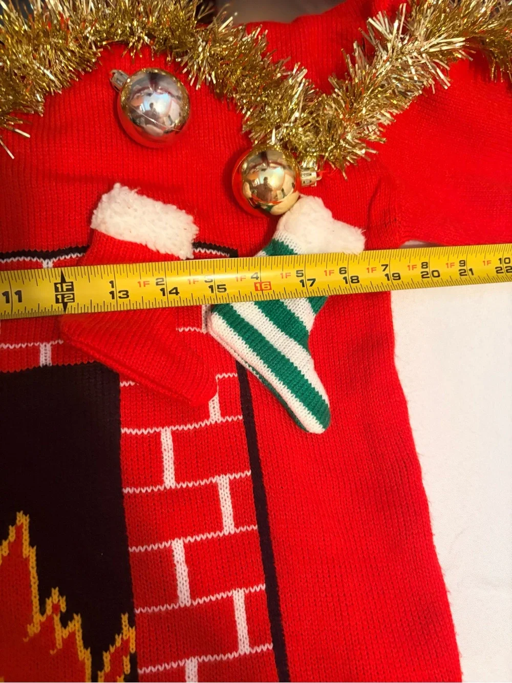 Red Holiday Fireplace Sweater with Tinsel and Stockings